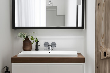 Wall-mounted vanity with white ceramic vessel sink. Interior design of modern scandinavian bathroom. Created with generative AI