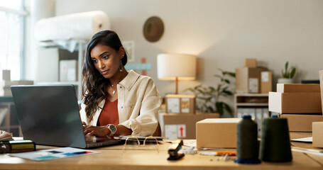 Woman, business and shipping on laptop in office for research, feedback and supply chain for ecommerce. Indian, person or planning on pc for logistics, stock administration or package distribution