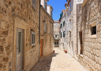 Fototapeta na wymiar Traditional narrow street in Hvar, Croatia