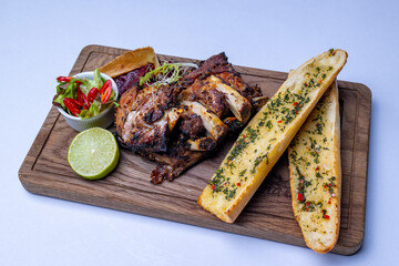Grilled pork ribs with garlic baguette