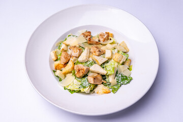 Caesar salad of romaine lettuce and croutons with egg yolks, parmesan cheese, lemon juice, wine vinegar, olive oil, garlic, worcestershire sauce, anchovies and black pepper.
