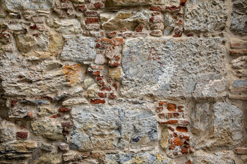 stone wall textured made of mesh and stones background horizontal facade