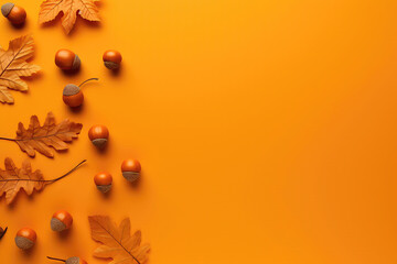Fototapeta premium Autumn Leaves And Acorns Adorn An Orange Background, Evoking Thanksgiving Vibes