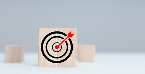 Photo mix of wooden block graphics and target icons, business target concept.