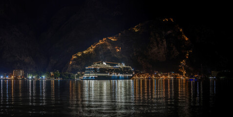 Cruise ship in the Port of Kotor Montenegro at night - obrazy, fototapety, plakaty