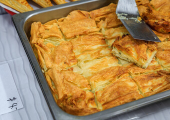 Sou boereg or sou boreg, Armenian layered filo dough puff pastry with cheese, butter and parsley at a food festival in San Francisco