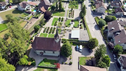 a higher Drone Flight Over Bätterkinden's 1664 Baroque Church: Aerial Views of Swiss History