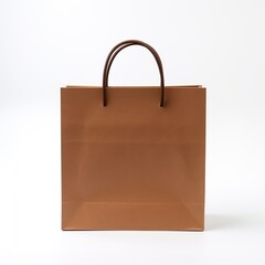 A tan brown shopping bag, folded and standing upright