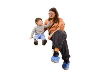 Happy toddler baby with a woman mother in the clinic waiting for a doctor s appointment. Mom with a baby boy in a modern hospital before receiving a pediatrician. Kid aged one year and three months