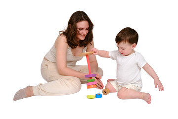 Happy baby with mother play educational toys on studio, isolated on white background. Portrait of a...