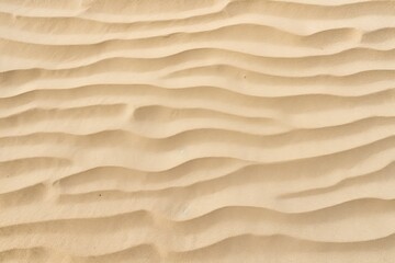 Fototapeta na wymiar Closeup of sand pattern of a beach in the summer.