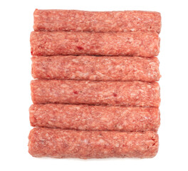 Row of fresh raw beef kebabs isolated on white
