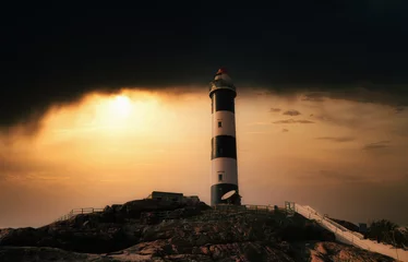 Zelfklevend Fotobehang lighthouse at sunset © vince