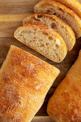 Homemade Ciabatta Bread on a wooden board, top view. Flat lay, overhead, from above.