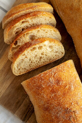 Homemade Ciabatta Bread on a wooden board, top view. Flat lay, overhead, from above.