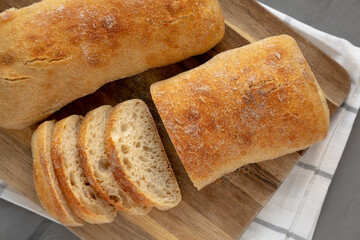 Homemade Ciabatta Bread on a wooden board, top view. Flat lay, overhead, from above.