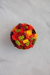 Colorful Fruity Gummy Bears in a Bowl, top view.