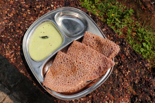 Ragi Ghavne and chutney, or Neer Dosa, is a popular breakfast dish from the Konkani or South Indian cuisine. Ghavne is a thin and delicate raagi crepe served with spicy coconut  chutney. 