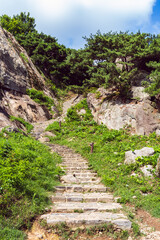 Fototapeta na wymiar Stone stairway to mountain-top