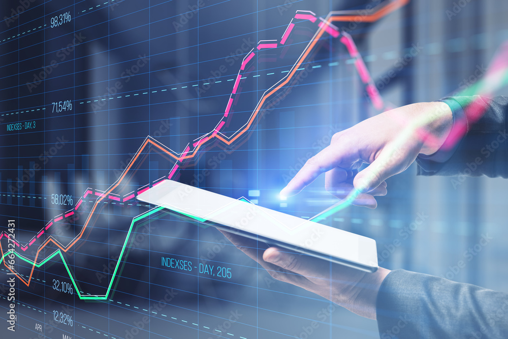 Aufkleber Close up of businessman hand using tablet with creative business graph with index and grid on blurry office interior background. Stock market and financial statistics concept. Double exposure.