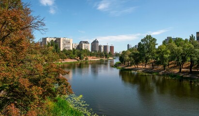 Residential district of Kyiv, Ukraine, in autumn, with the Dnieper river channel in the foreground