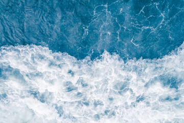 Pale blue sea wave during high summer tide, abstract ocean background - 664273891