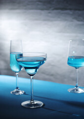 Glasses with blue alcohol cocktail ready for a party	