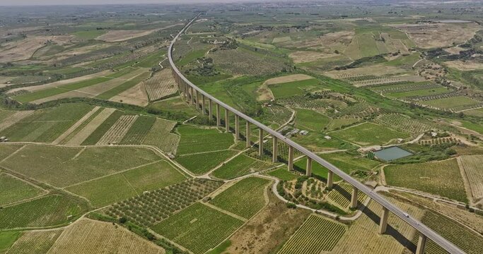 Borgo Vecchio Italy Aerial v1 birds eye view drone flyover country town capturing vast farmlands and vineyards, with a highway bridge spanning across the landscape - Shot with Mavic 3 Cine - June 2023