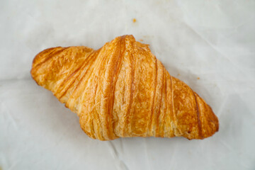 Plain Croissant isolated on grey background top view of french breakfast baked food item on grey background