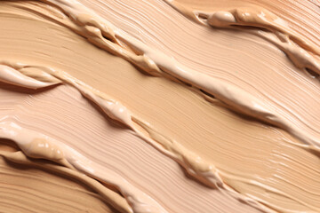 Samples of skin foundation as background, closeup