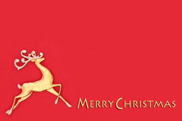 Merry Christmas gold reindeer tree ornament on red background. Decorative design for greeting card, gift tag, letter, menu, invitation.