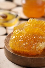 Natural honeycombs on textured table, closeup. Space for text