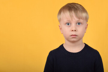 portrait of a boy child, surprised face