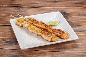 Grilled salmon skewer with sauce