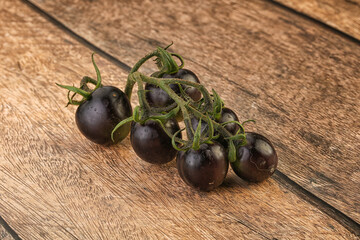 Ripe tasty black cherry tomato