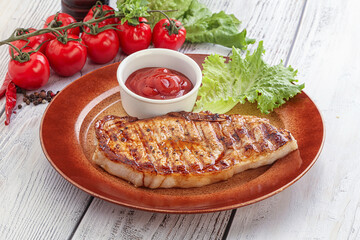 Grilled pork steak with ketchup