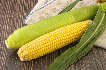 Yellow sweet raw cob corn