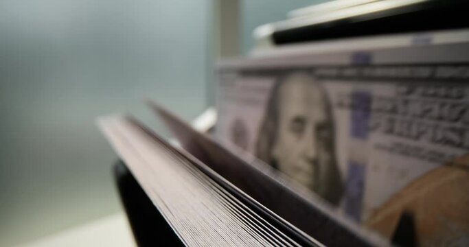 Counting machine for counting dollar bills. Banking and commercial activities