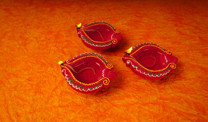 Clay diya lamps lit during Diwali Celebration. Greetings Card Design Indian Hindu Light Festival called Diwali