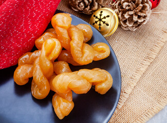 Traditional South African koeksister, sweet treats on festive Christmas table.
Perfect traditional Christmas treat
