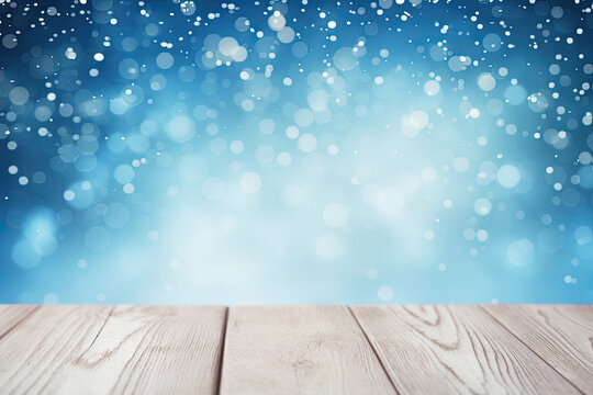 Beautiful winter snowy blurred blue background and empty wooden table