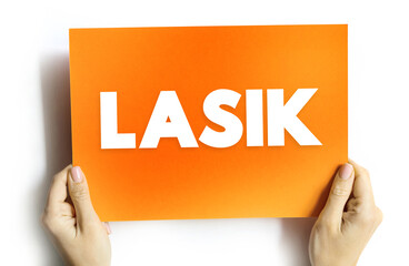 LASIK commonly referred to as laser eye surgery or laser vision correction, text concept on card for presentations and reports - obrazy, fototapety, plakaty