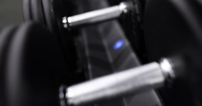 Rows of dumbbells in gym. Fitness sport health and weight training