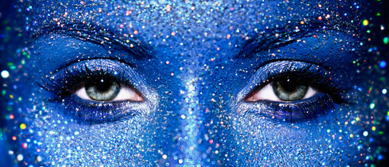 Beautiful female eyes with sparkles on her face. Art design colorful glitter glowing make up
