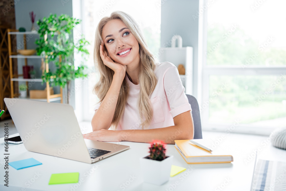 Wall mural Photo of adorable pretty cute lady assistant sitting living room in modern house indoors dreaming weekend vacation