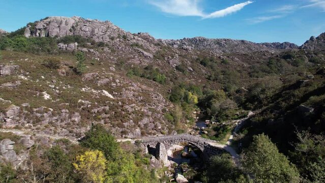 Flying Over Ancient Stone Bridge Over Beautiful River. Amazing Nature Landscape