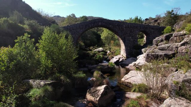 Flying Over Ancient Stone Bridge Over Beautiful River. Amazing Nature Landscape