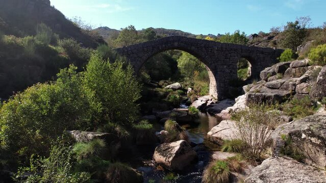 Flying Over Ancient Stone Bridge Over Beautiful River. Amazing Nature Landscape