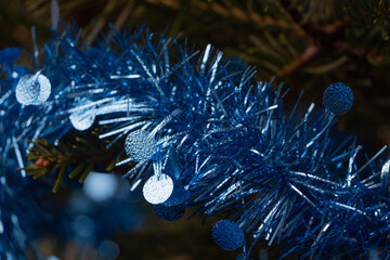 Blue tinsel on a Christmas tree