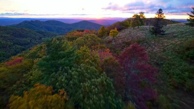 aerial pullout with fall and autumn leaf color in appalachian mountains between boone and blowing rock nc, north carolina